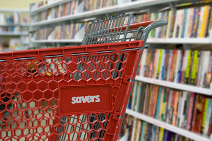 Savers shopping cart in the book aisle.