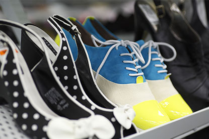 Polka dotted pumps and blue, white, yellow saddle shoes.