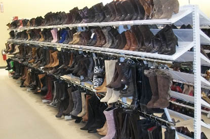 Shelves of boots in the shoe department.