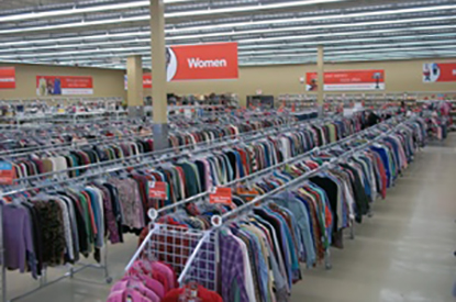 Racks of clothing inside store.