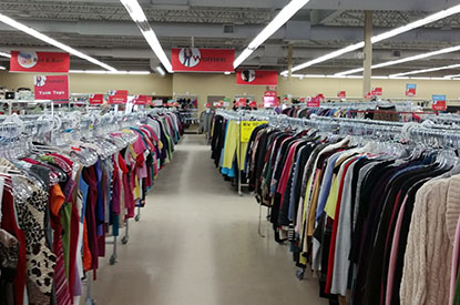 Racks of clothing inside store.