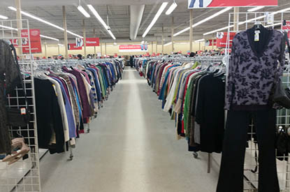 Racks of clothing inside store.