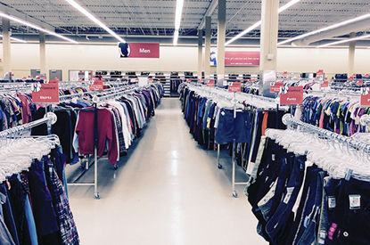 Racks of clothing inside store.