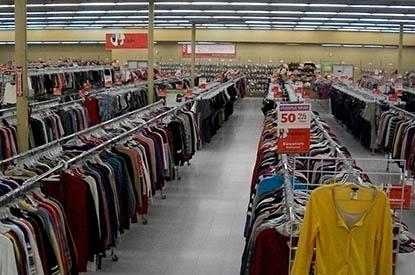 Person shopping in the tops aisle.