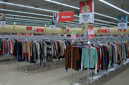 Racks of clothing inside store.