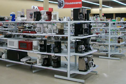 Shelves of small appliances in the housewares department.
