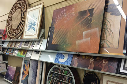 Paintings and artwork in the housewares department.