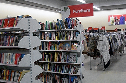 Books and clothing near the furniture department.