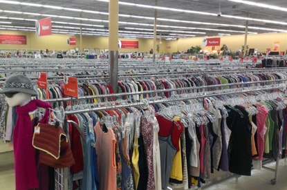 Person shopping in the tops aisle.