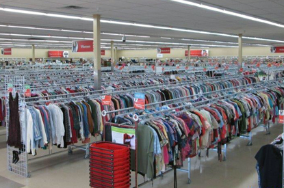 Racks of clothing inside store.