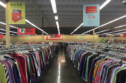 Racks of clothing inside store.