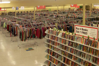 Racks of clothes and shelves of books.