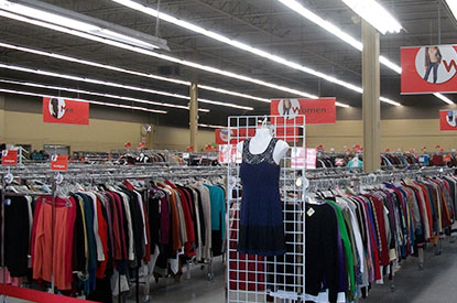 Racks of clothing inside store.