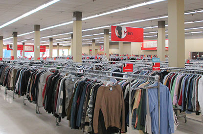 Racks of clothing inside store.