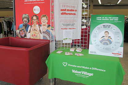 Donation bin and information table at the front of the store.