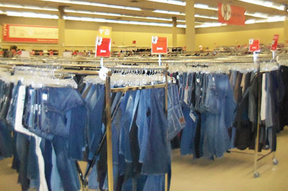 Racks of blue jeans.