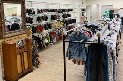 Racks of clothes and purses in our Value Village boutique store.