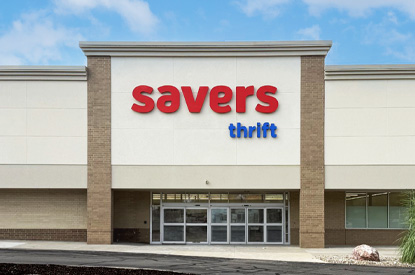 Savers shopping cart in the book aisle.